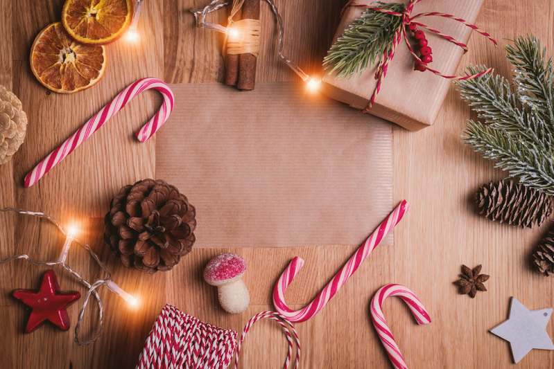 Stylish seasonal decor blog workspace with mood boards, fabric swatches, and seasonal props